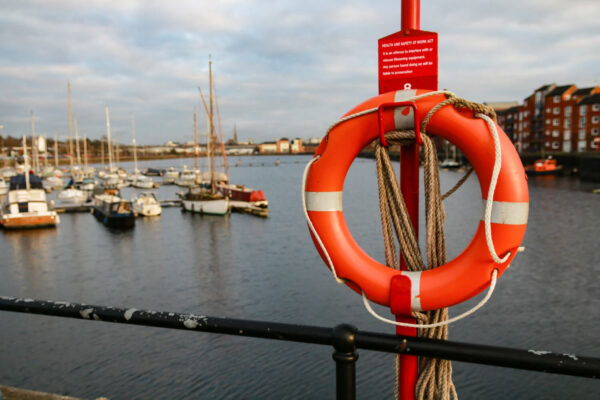 selective-focus-shot-lifebuoy-ring-sailboat